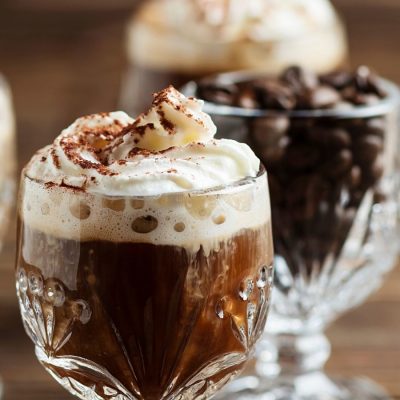 Hot Mexican Coffee Cocktail in a glass with cream