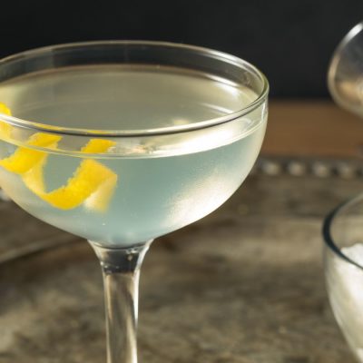 50 50 martini with lemon twist on a silver tray