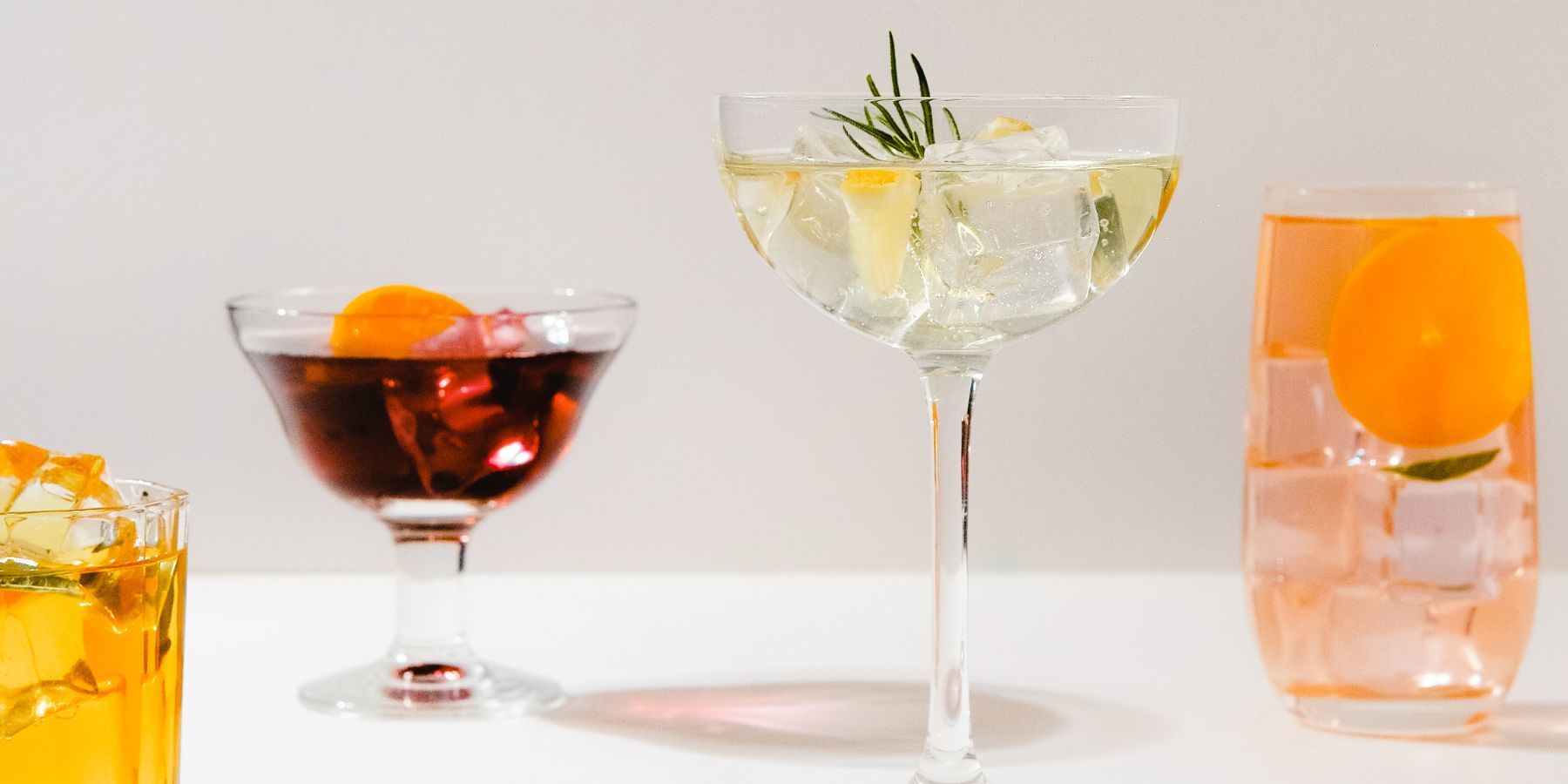 https://www.themixer.com/en-uk/wp-content/uploads/sites/3/2022/07/237.US_Cocktail-Glass-Types_Canva_MAEknl6zO4Y-assorted-cocktail-drinks-in-glasses.jpg