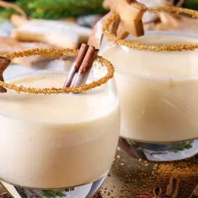 Eggnog Christmas cocktail with cinnamon and stars