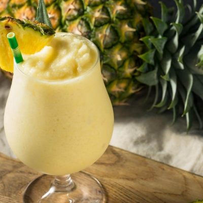 Frozen Pina Colada cocktail with pineapple garnish