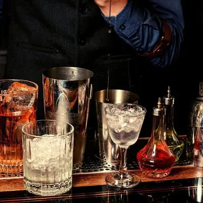 Bartender measuring a single pour of liquor