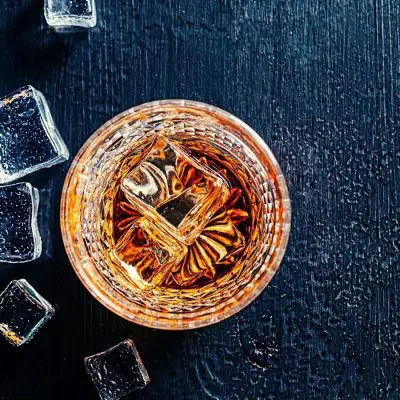 Top shot of Japanese Whiskey drink and ice cubes