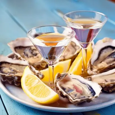 Two tiny Martinis served with oysters