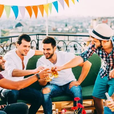 Five friends toasting on a bachelor party