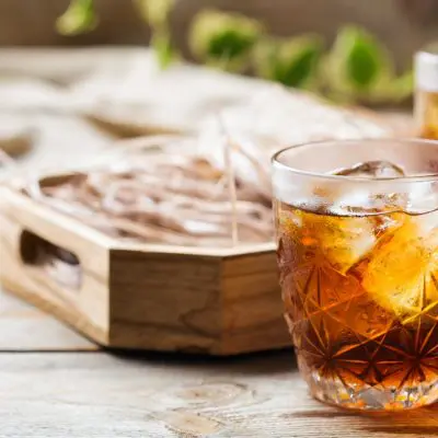 Two Averna cocktails on a wooden table