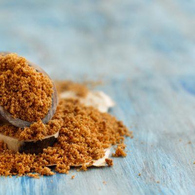 Brown sugar on a wooden spoon