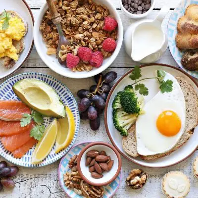 Top view of an amazing array of brunchtime foods on a table