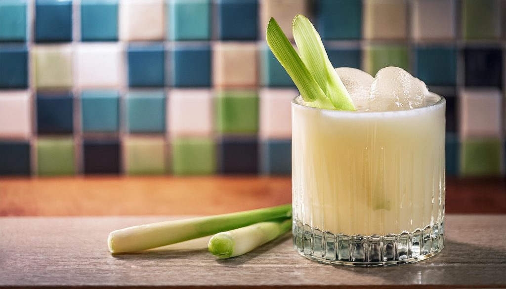 A creamy Savoury Hunter cocktail with lemongrass garnish