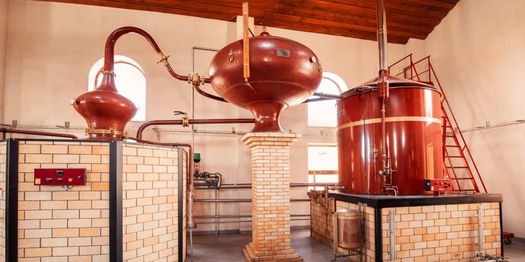 Copper pot stills used in cognac-making, photo by EdNurg