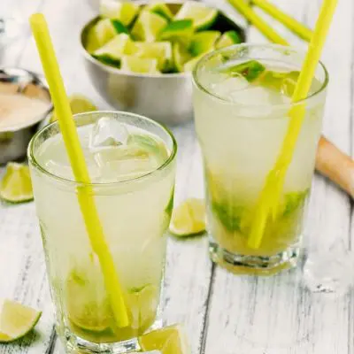 Refreshing Caipirinhas with muddled lime