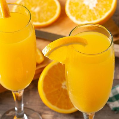 Orange Juice Mimosas in flutes