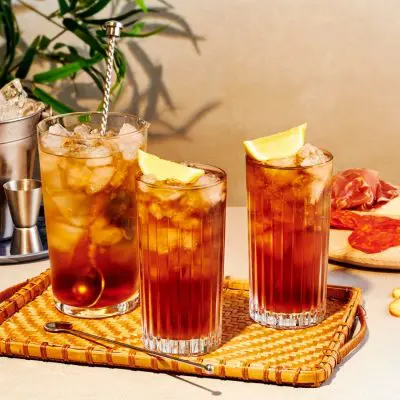 Front image of three homemade Long Island Ice Tea Cocktails with Lemon garnish