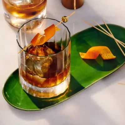 Top view of rich Old Fashioned Cocktails with Orange peel garnish