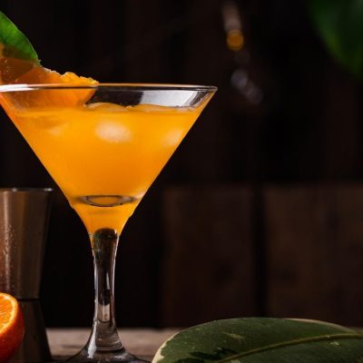 Refreshing orange Bronx cocktail in martini glass