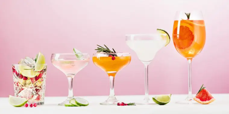 https://www.themixer.com/en-us/wp-content/uploads/sites/2/2022/07/240.US_What-are-the-6-Basic-Cocktails_Canva_MAETwXrV7rQ-the-rose-exotic-cocktails-and-fruits-on-pink-760x380.jpg