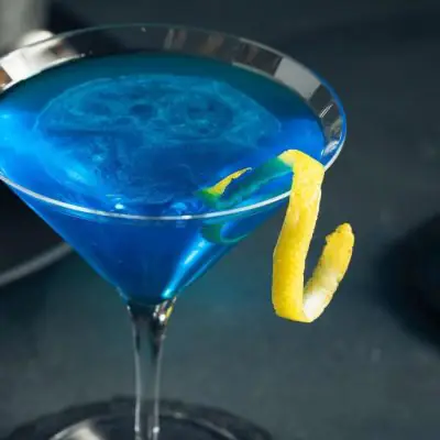 Blue Martini with a lemon twist garnish