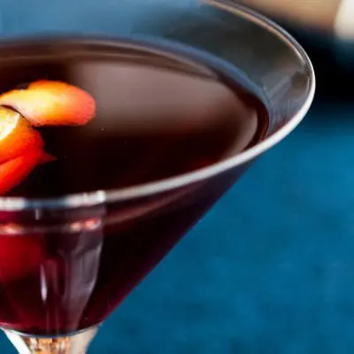 Italian Manhattan in a martini glass with orange peel