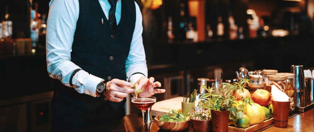 Japanese Bartender garnishing a cocktail