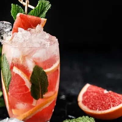 Refreshing non-alcoholic grapefruit spritzer with fresh mint garnish