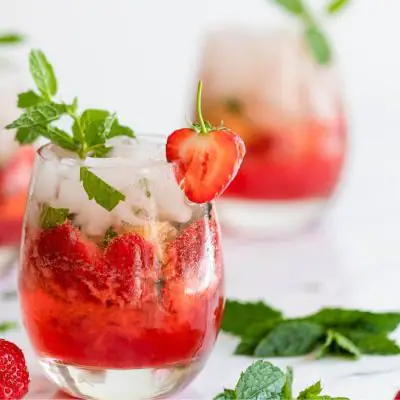Strawberry Mojito Mocktails with mint and berry garnish