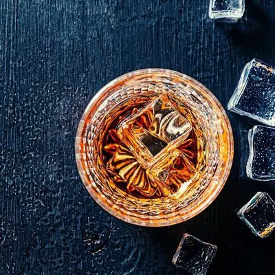 Top shot of Japanese whiskey drink with ice cubes