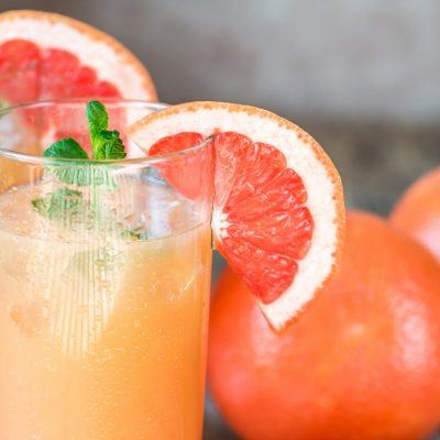 Two Grapefruit Cocktails with grapefruit garnish