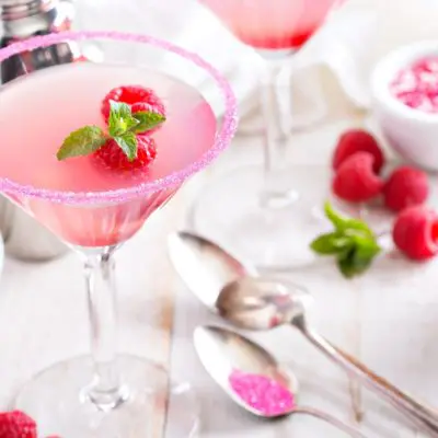 Two raspberry Martini cocktails