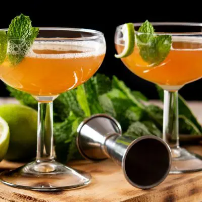 Old Cuban Cocktail with mint and lime garnish