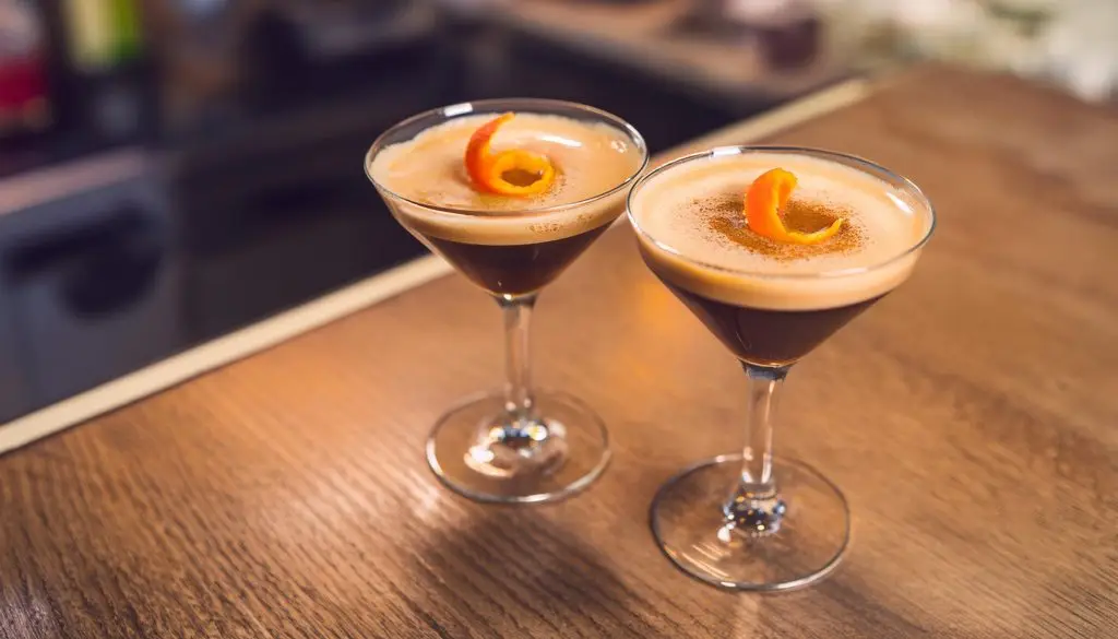 Two Aperitivo Espresso on a wooden counter in a modern home lounge space