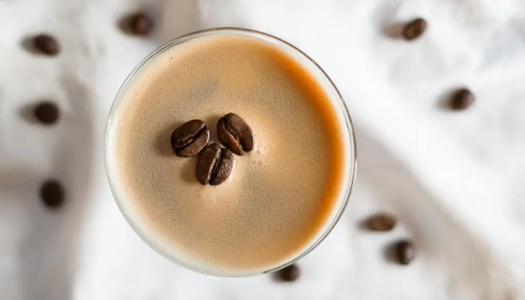 Top view of an Espresso Martini garnished with three coffee beans for good luck