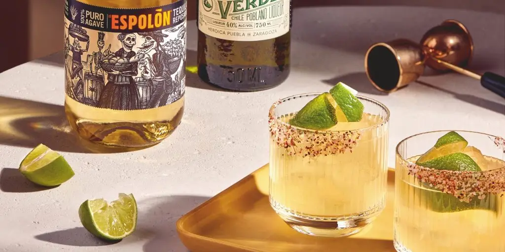 Two Espolòn Spicy Margaritas with lime garnish 